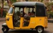 A yellow auto rickshaw